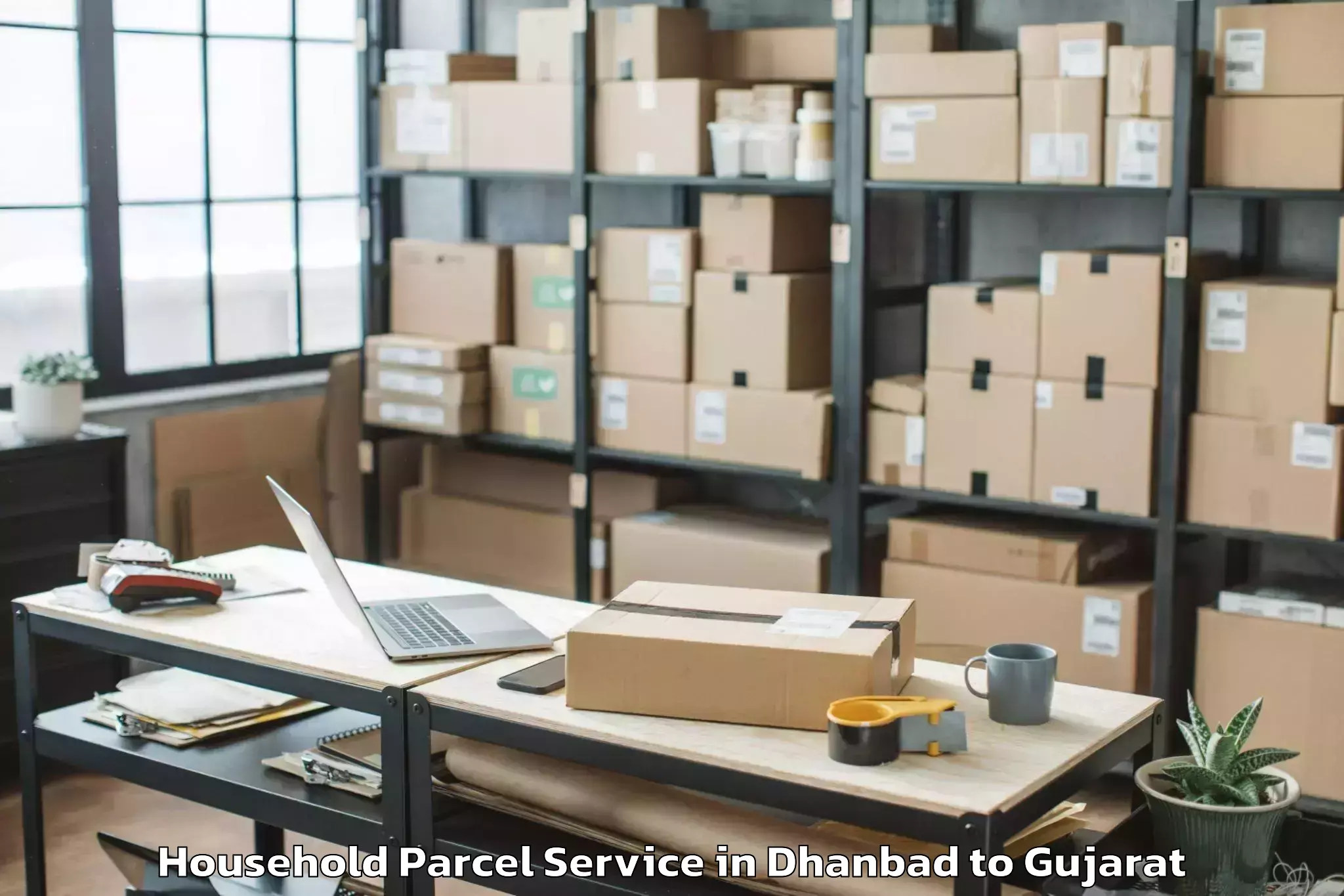 Book Your Dhanbad to Gujarat National Law Universit Household Parcel Today